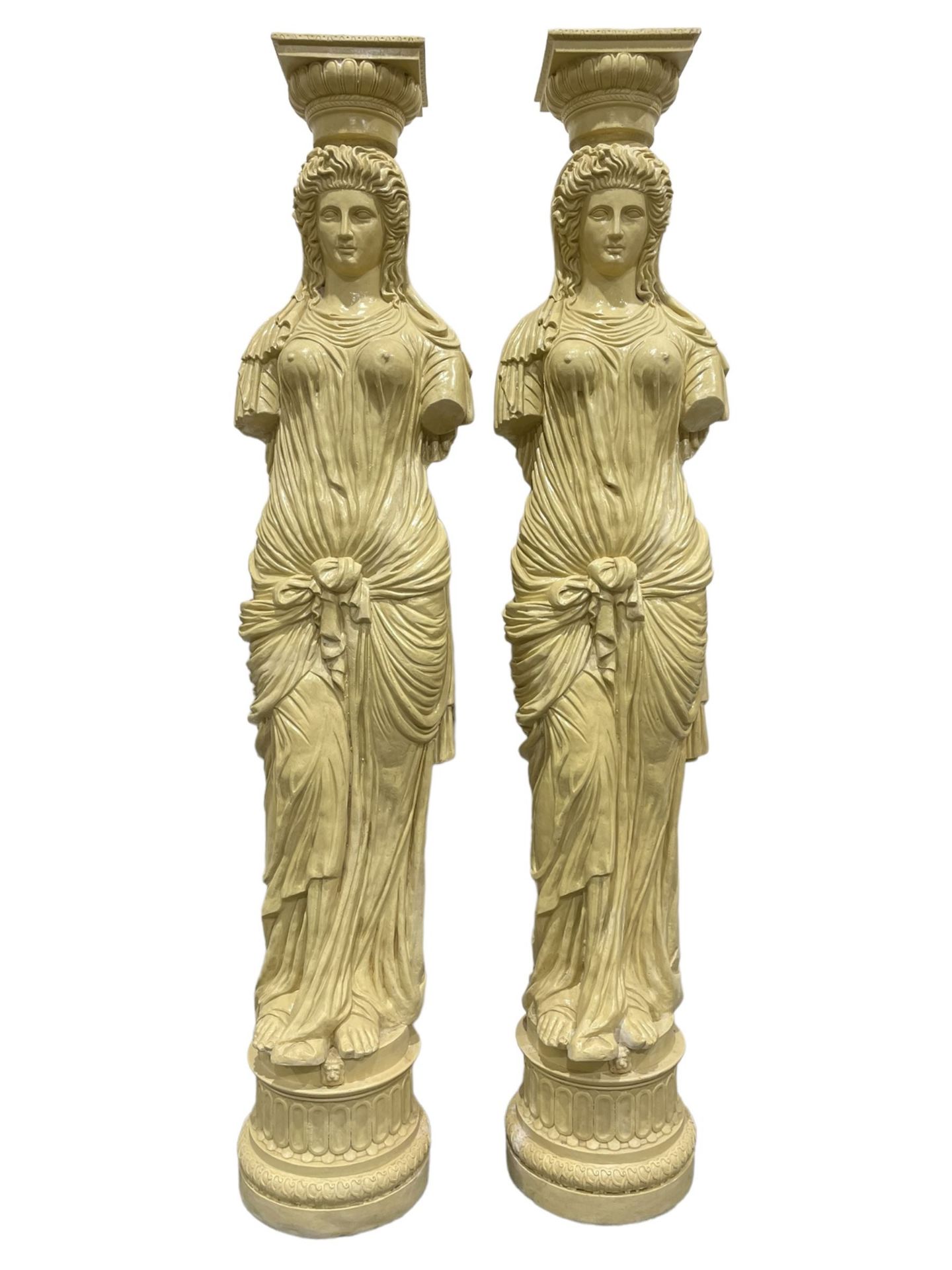 A Pair of Greek style caryatid columns, square top with gadroon underbelly, the semi-nude female