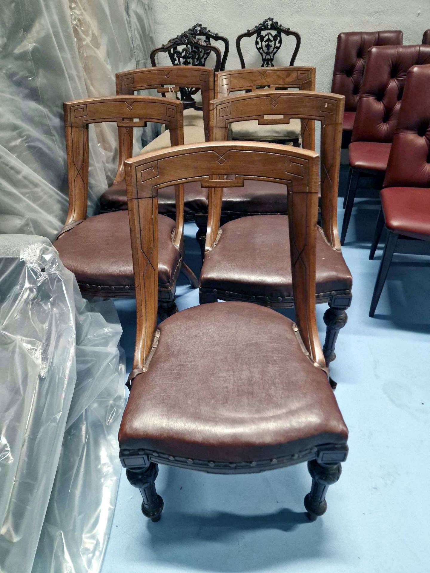 Five French Empire Gondola Chairs Each having a scalloped wide crest continuing to sloping stiles