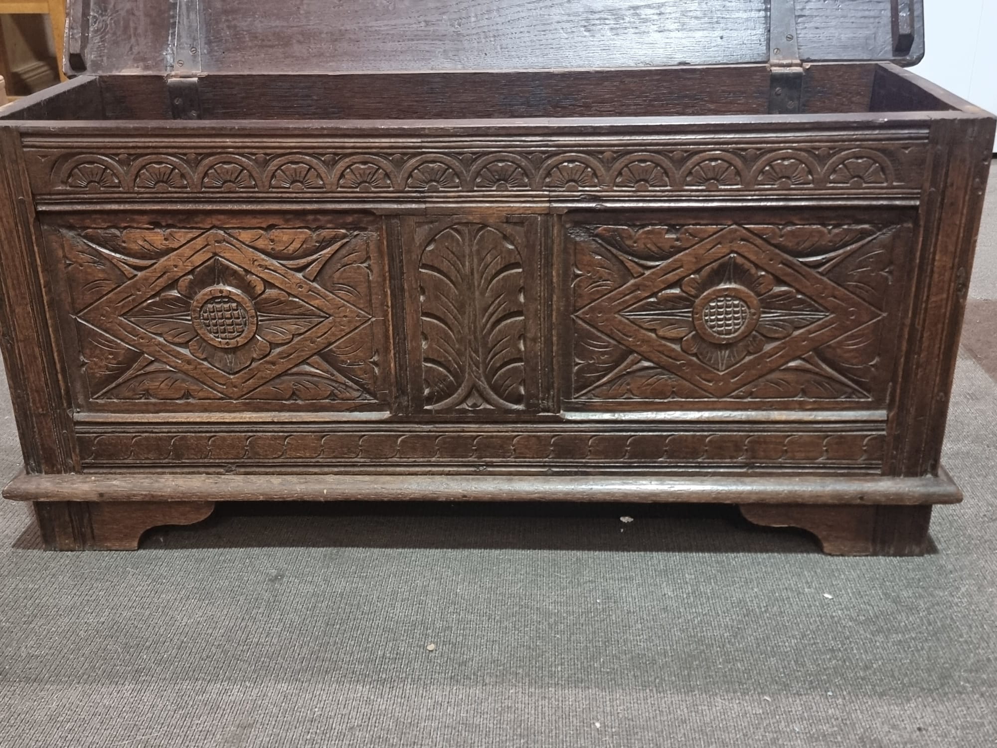 Late 18th Century style oak coffer the plank top above three geometrically carved panels on the - Image 2 of 17