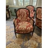 A Pair Of Bergere Chairs Black Wood Frame Upholstered In A Rust Red And Cream Damask Pattern With