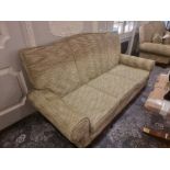 Upholstered Three Seater Sofa Classically Styled With A Shaped Back Rest And Rolled Arms On A