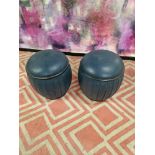 A pair of upholstered blue leather drum ottoman stools 37 x 42cm