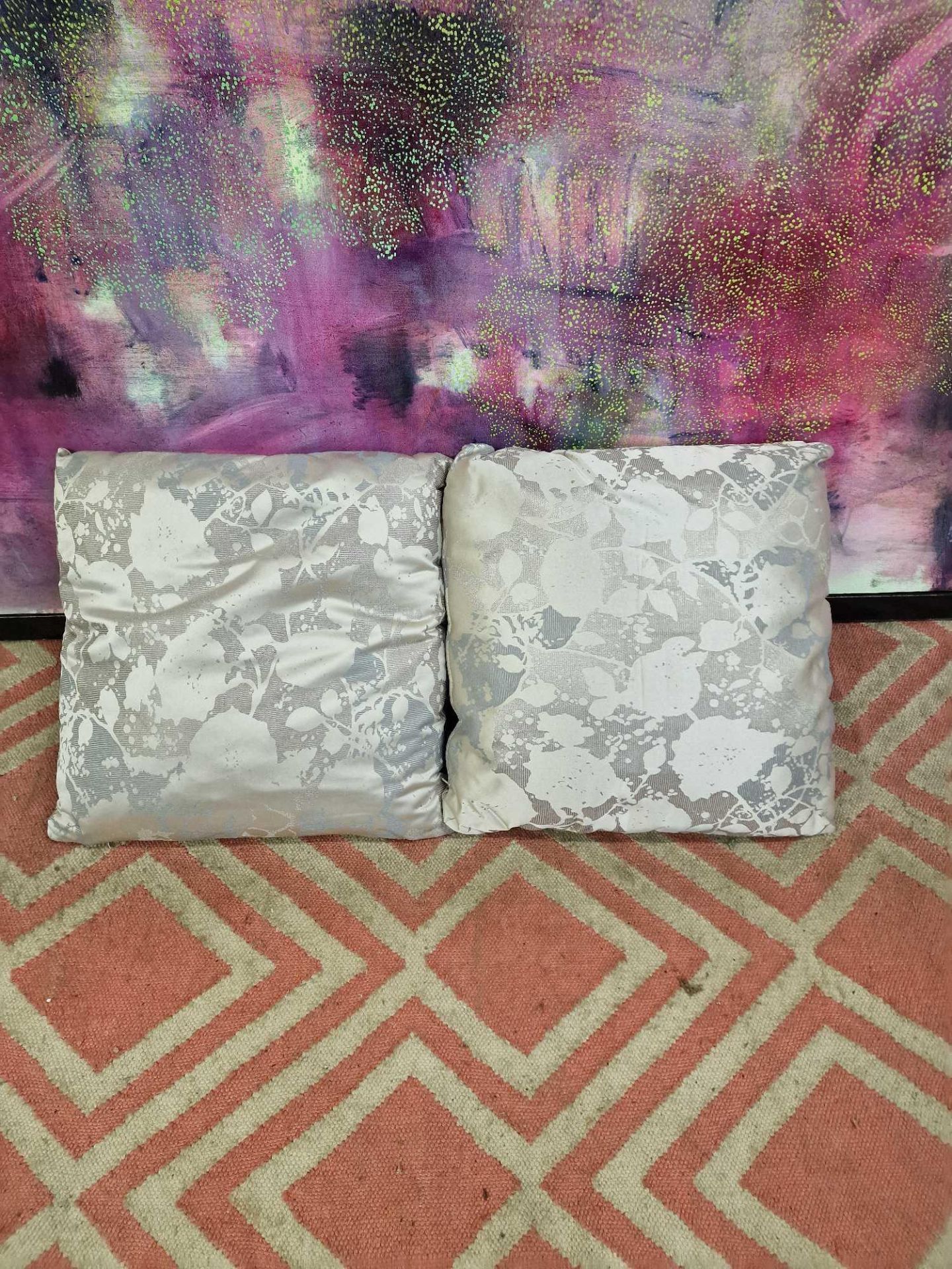 A pair of Silver silkeen patterned cushions 45 x 45cm