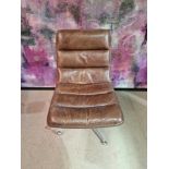 Leather Chair Inspired by a classic 1960s midcentury silhouette, the chairs graceful contours hug