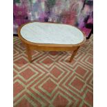 Coffee table oak oval table with a white marble top inset enhanced by silver metal trim 100 x 55 x