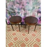 A pair of mahogany drum side tables the circular top 55cm wide with a brass trim detail on square