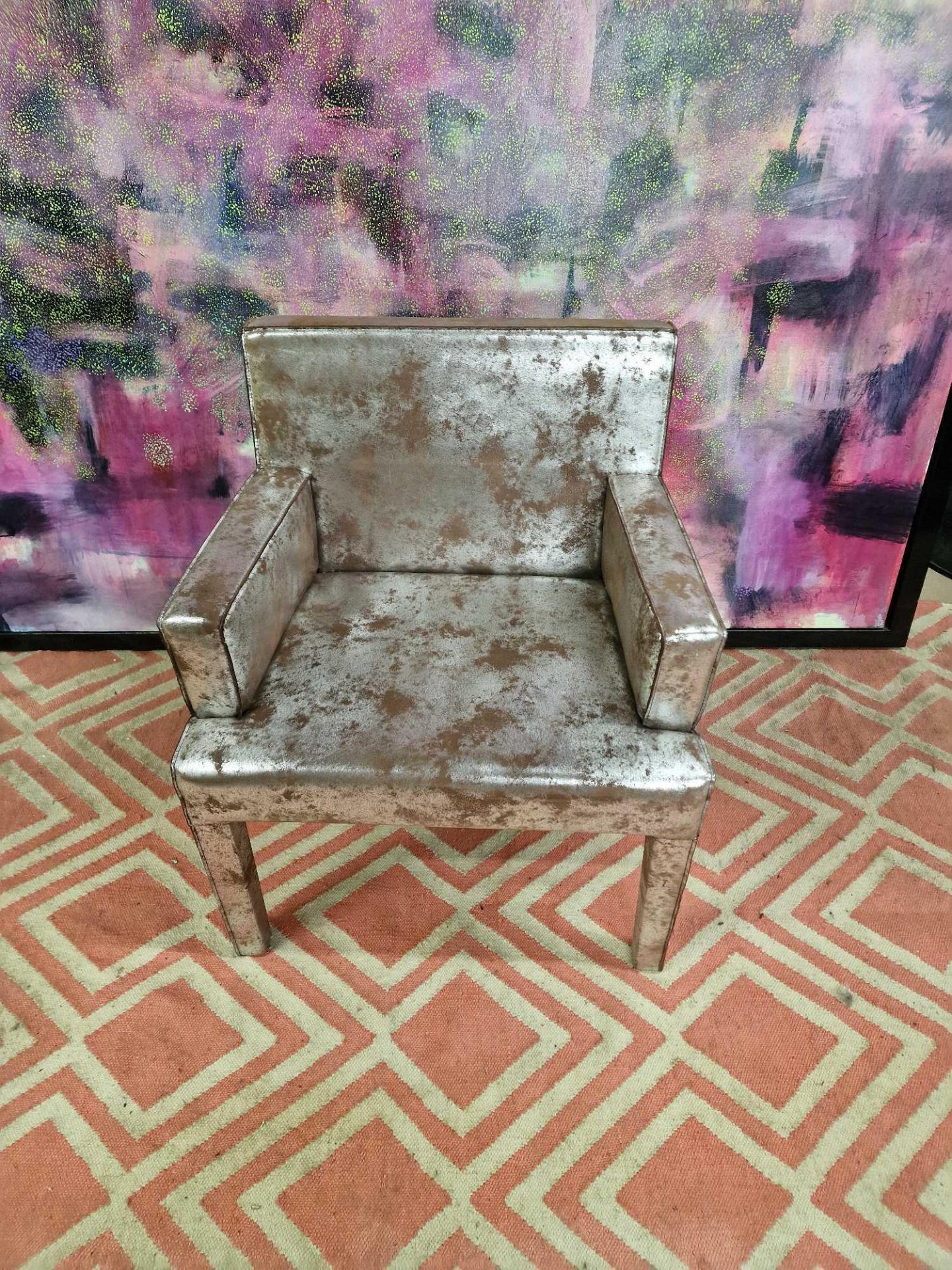 Cravt Original Amsterdam Stockholm Dining Armchair upholstered in a silver and brown rust cow