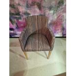 Contemporary dining chair Upholstered in a modern striped pattern fabric, the high arm rests and