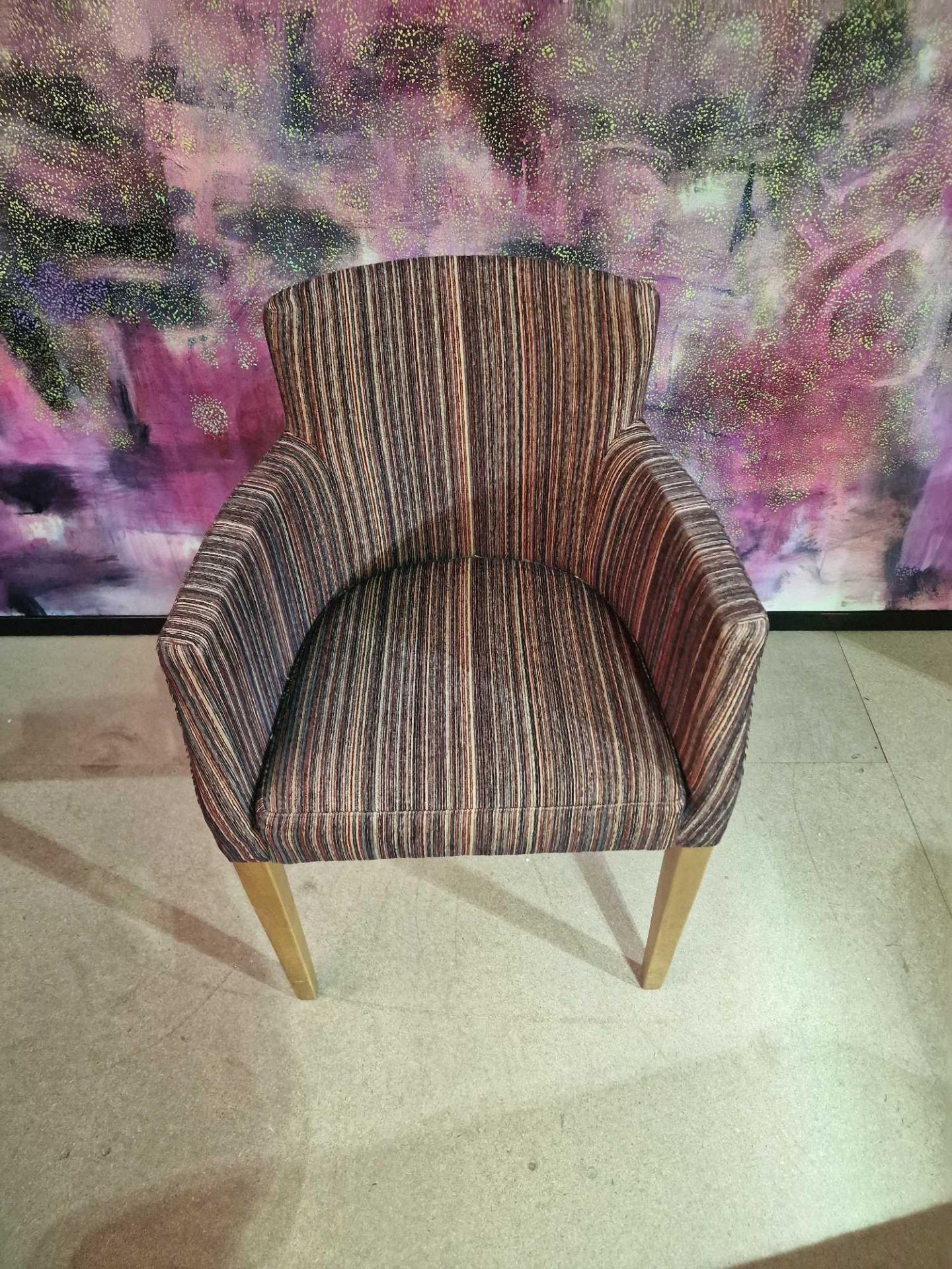 Contemporary dining chair Upholstered in a modern striped pattern fabric, the high arm rests and