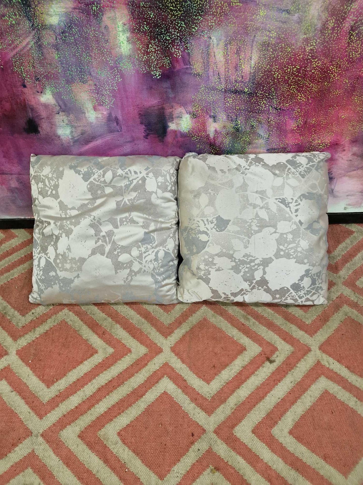 A pair of Silver silkeen patterned cushions 45 x 45cm