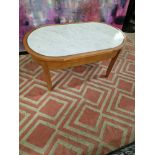 Coffee table oak oval table with a white marble top inset enhanced by silver metal trim 100 x 55 x