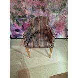 Contemporary dining chair Upholstered in a modern striped pattern fabric, the high arm rests and