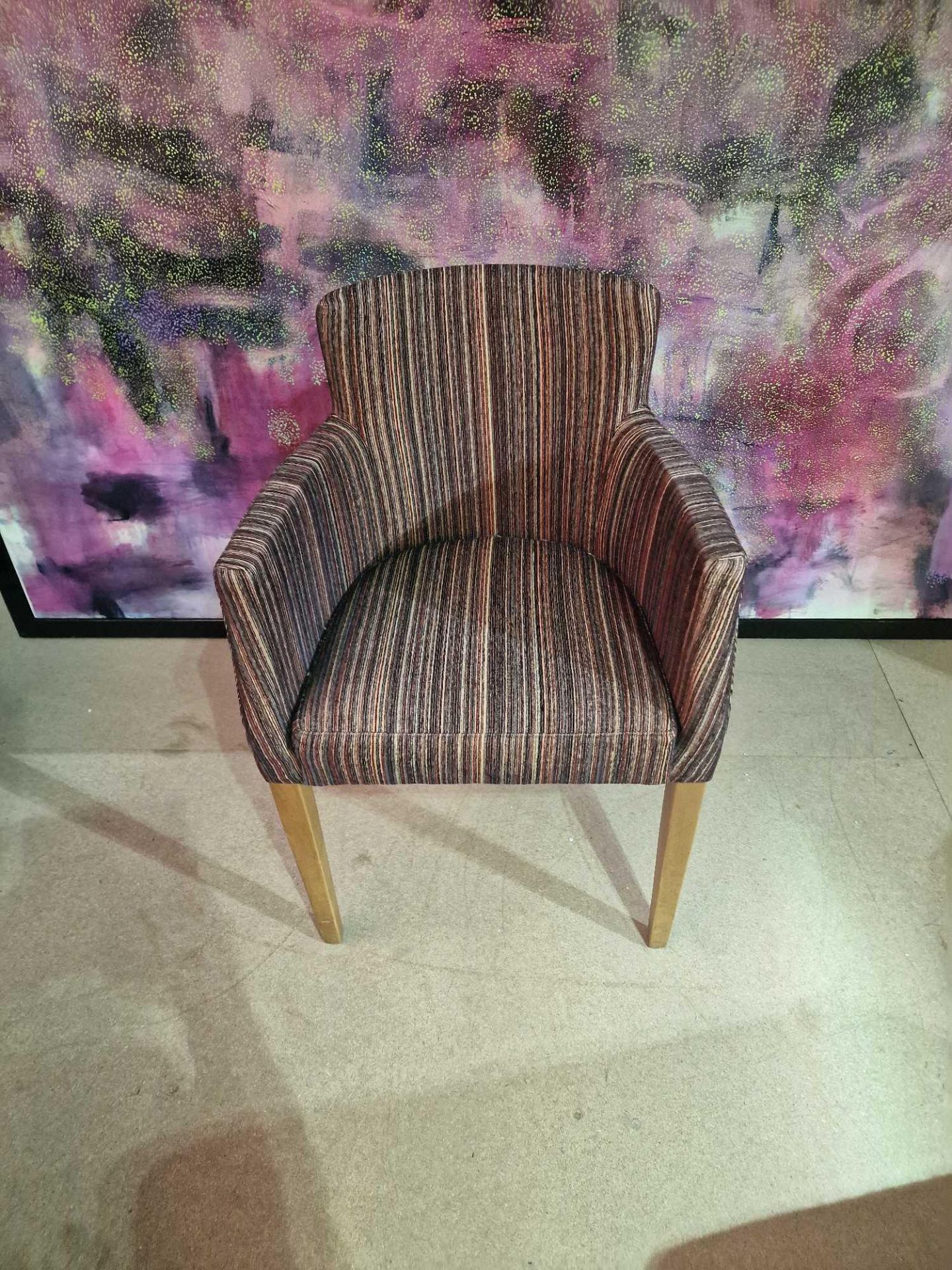 Contemporary dining chair Upholstered in a modern striped pattern fabric, the high arm rests and