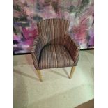 Contemporary dining chair Upholstered in a modern striped pattern fabric, the high arm rests and