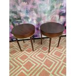 A pair of mahogany drum side tables the circular top 55cm wide with a brass trim detail on square