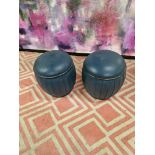 A pair of upholstered blue leather drum ottoman stools 37 x 42cm