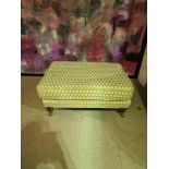 Footstool by Kesterport A yellow & White upholstered footstool on turned wooden legs with brass