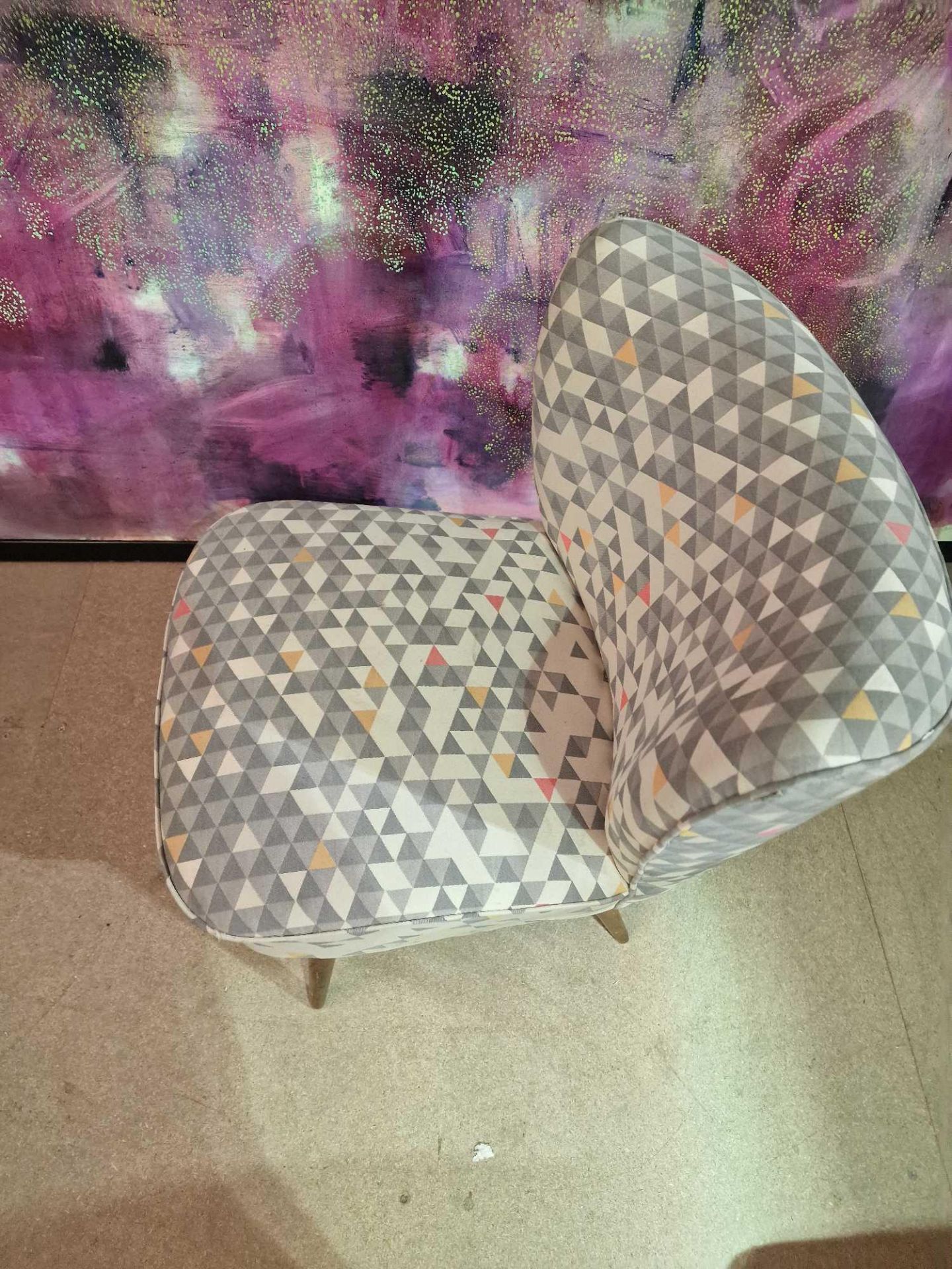 Slipper chair by Self Style Steeped in luxury, the geometric pattern upholstered chair is an elegant