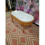 Coffee table oak oval table with a white marble top inset enhanced by silver metal trim 100 x 55 x