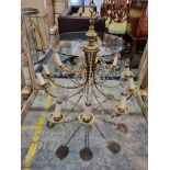 A 10 Arm Vintage French Brass and Crystal Chandelier With A Baluster Shaped Body With Ten