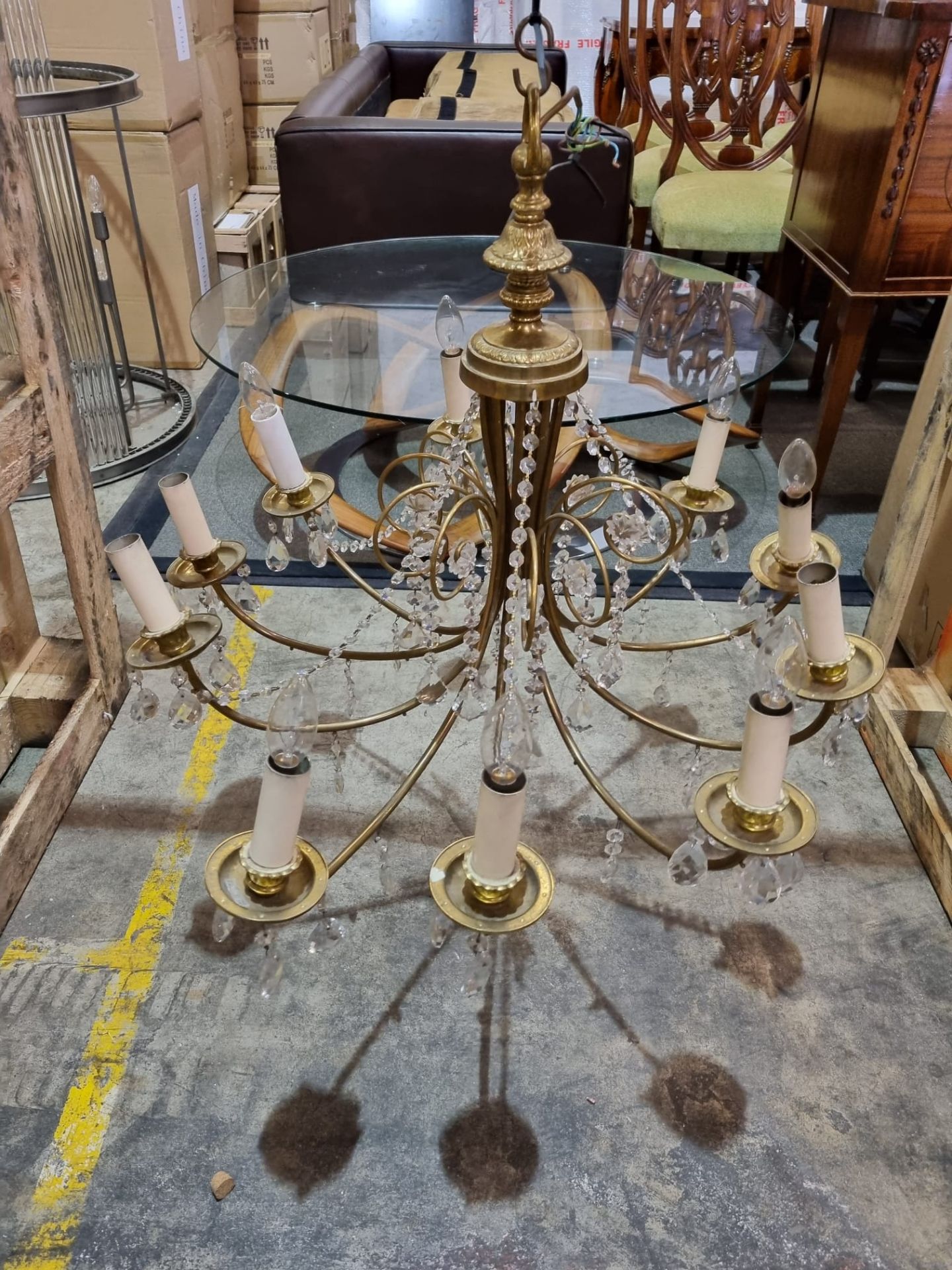 A 10 Arm Vintage French Brass and Crystal Chandelier With A Baluster Shaped Body With Ten