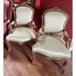 A Pair of Fauteuils In Louis XVI Style Carved Gilt Wood Arm Chairs Upholstered In Fleur De Lys