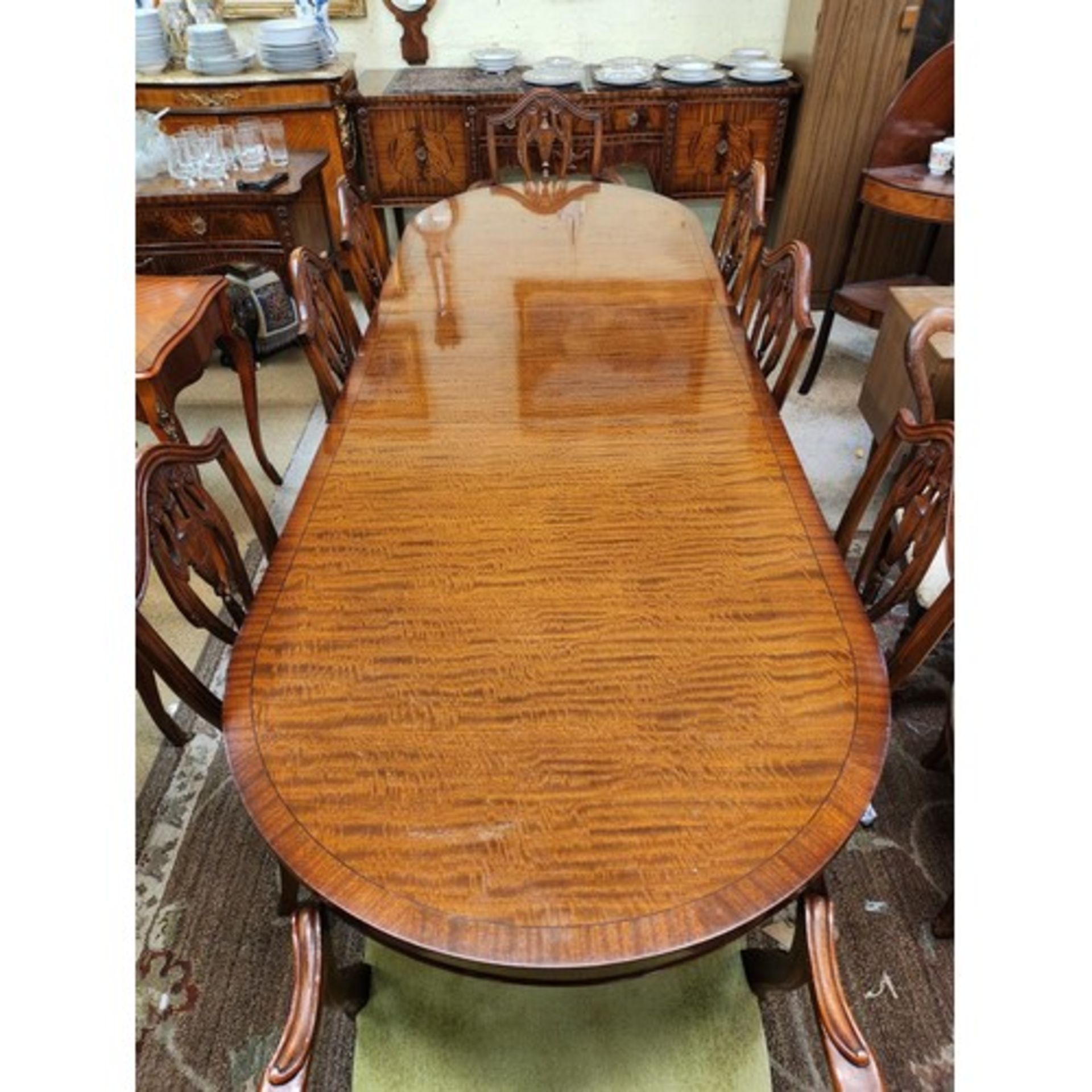 Cabinet Makers: H.& L. Epstein, London A Fine Figured Mahogany Oval Ended Dining Table With Extra - Image 14 of 14