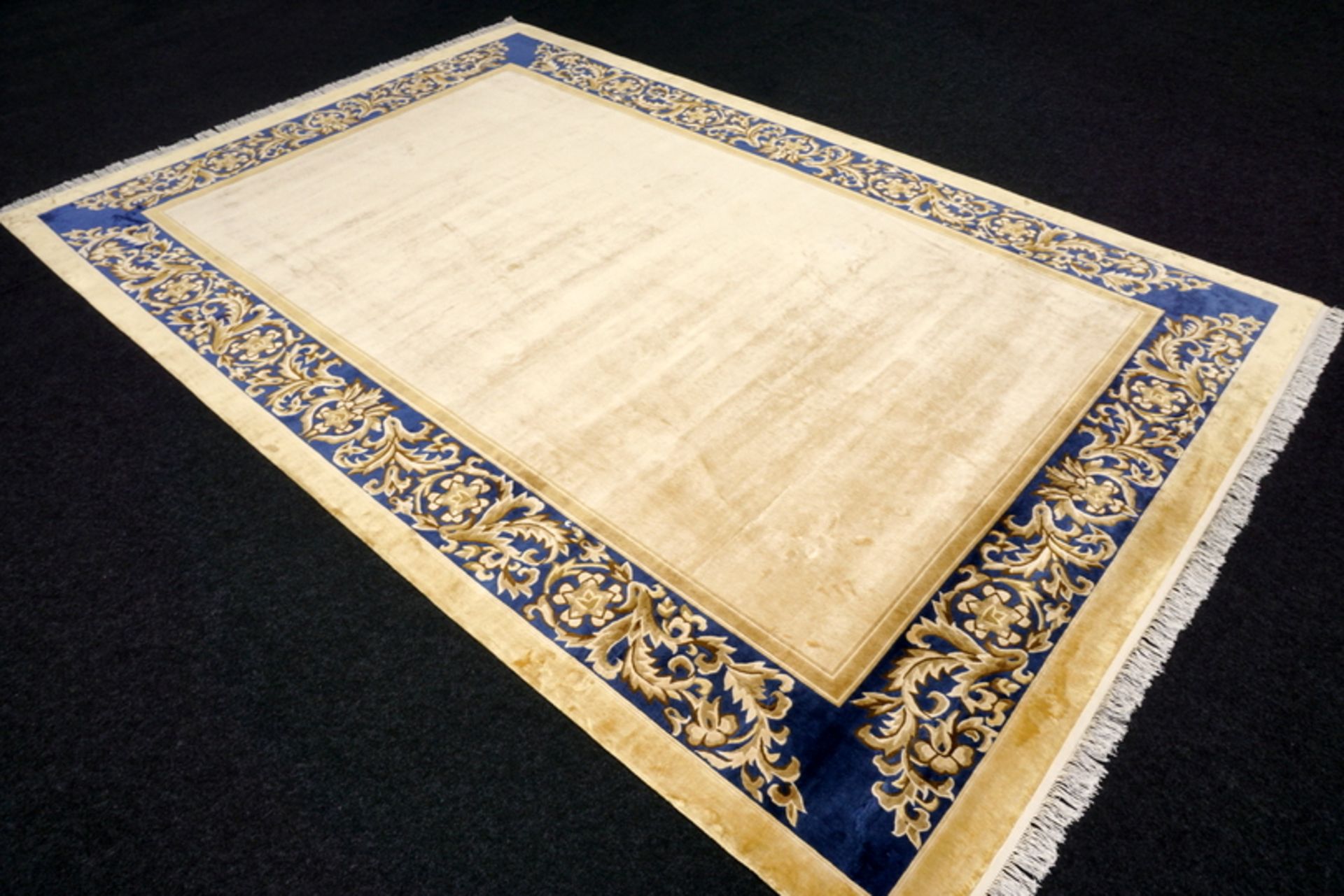 A Chinese Silk Carpet, Tientsin, Silk On Silk Foundation The Plain Ivory Field With A Blue Border