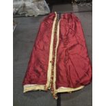 A pair of silk red and gold drapes pencil pleat with tassel fringe each panel 64cm wide x 260cm drop