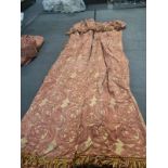 A pair of heavy cotton pencil pleat lined drapes with gold and red pattern with a pelmet top