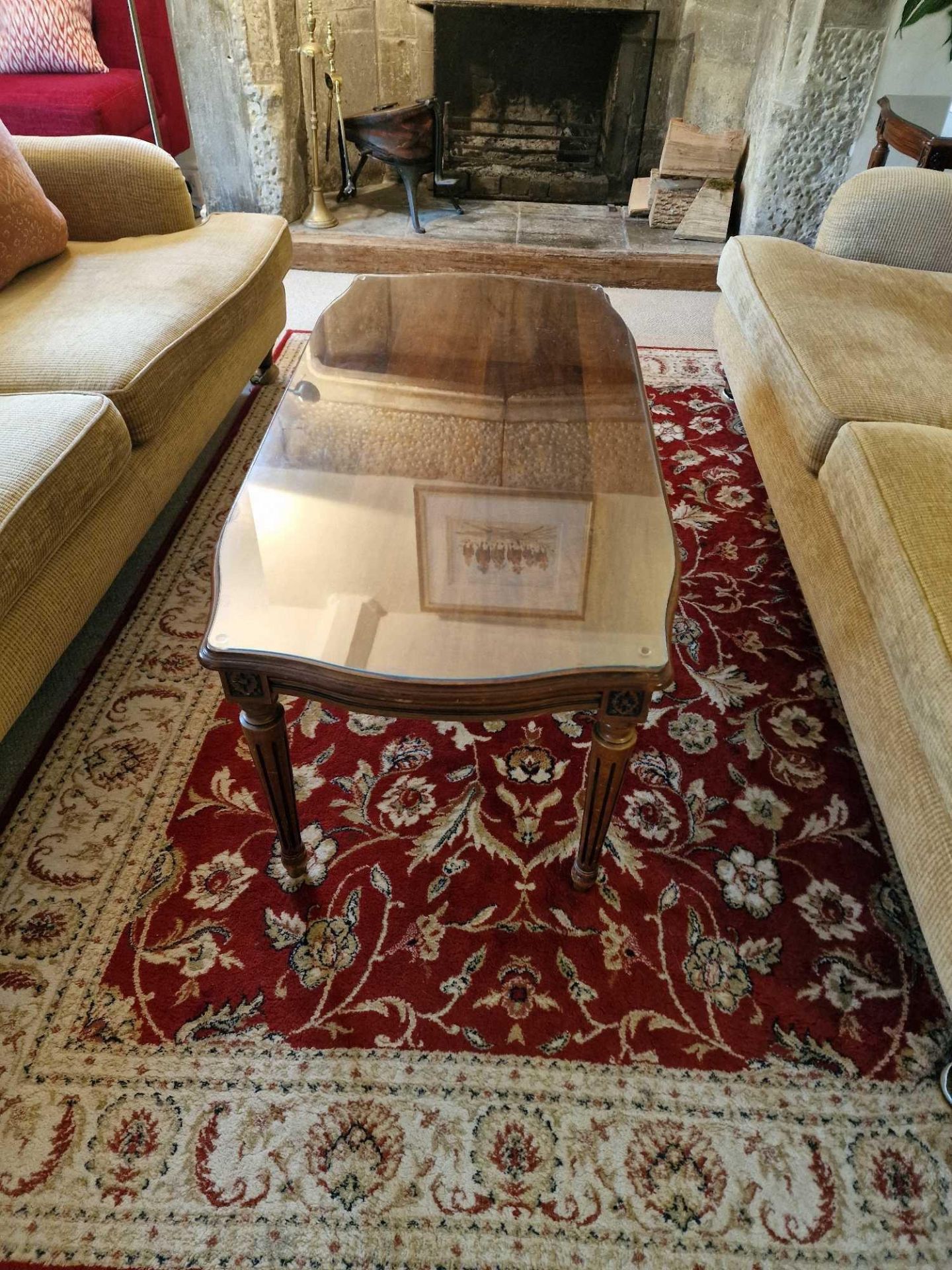 A Regency Style Coffee Table Well Figured Mahogany Top Raised On Tapered And Turned Fluted Legs With