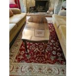 A Regency Style Coffee Table Well Figured Mahogany Top Raised On Tapered And Turned Fluted Legs With