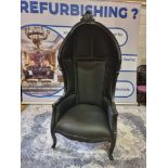 A solid mahogany hardwood upholstered in tactile black citroen Porters Chair modelled on the