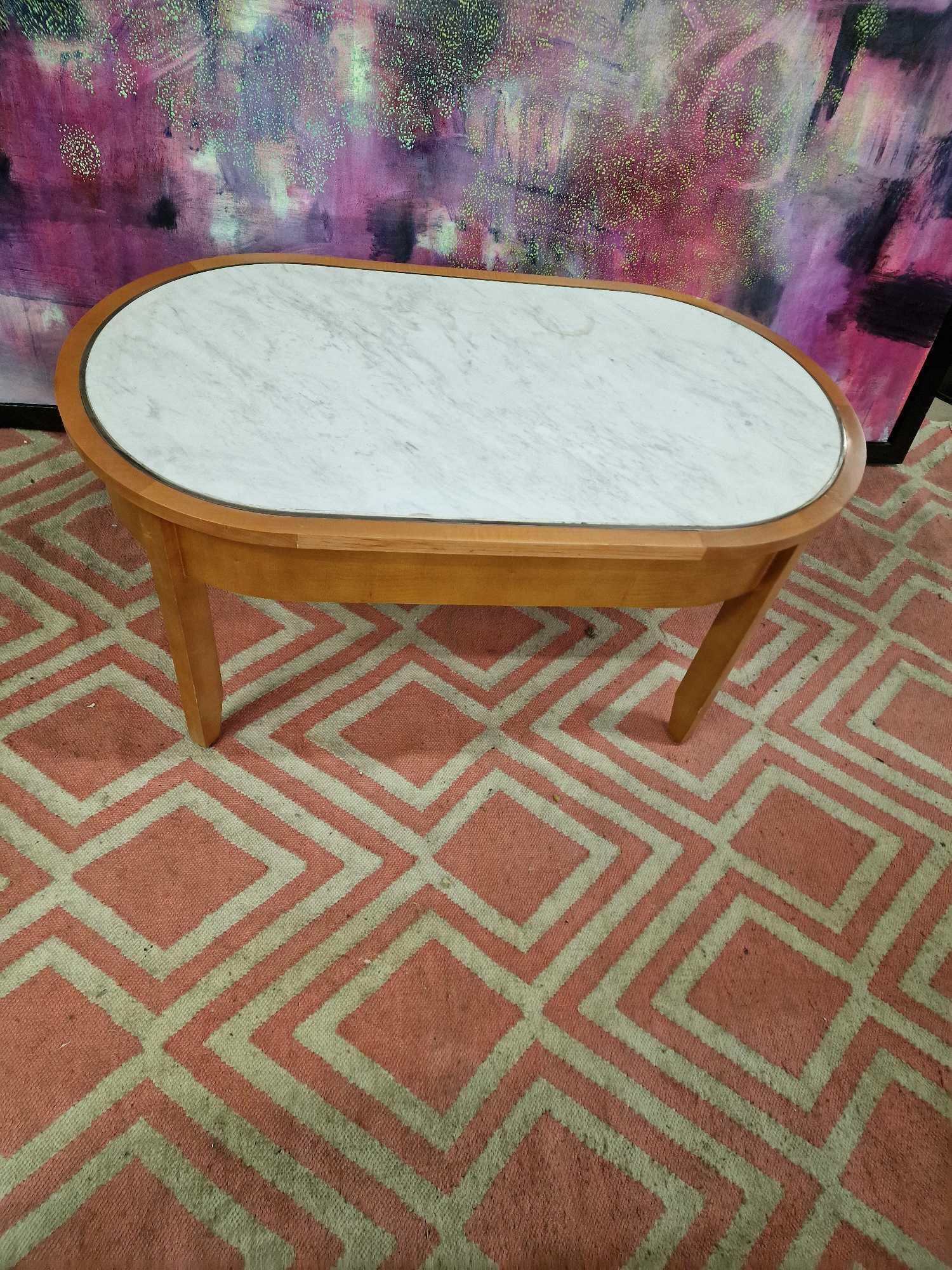 Coffee table oak oval table with a white marble top inset enhanced by silver metal trim 100 x 55 x