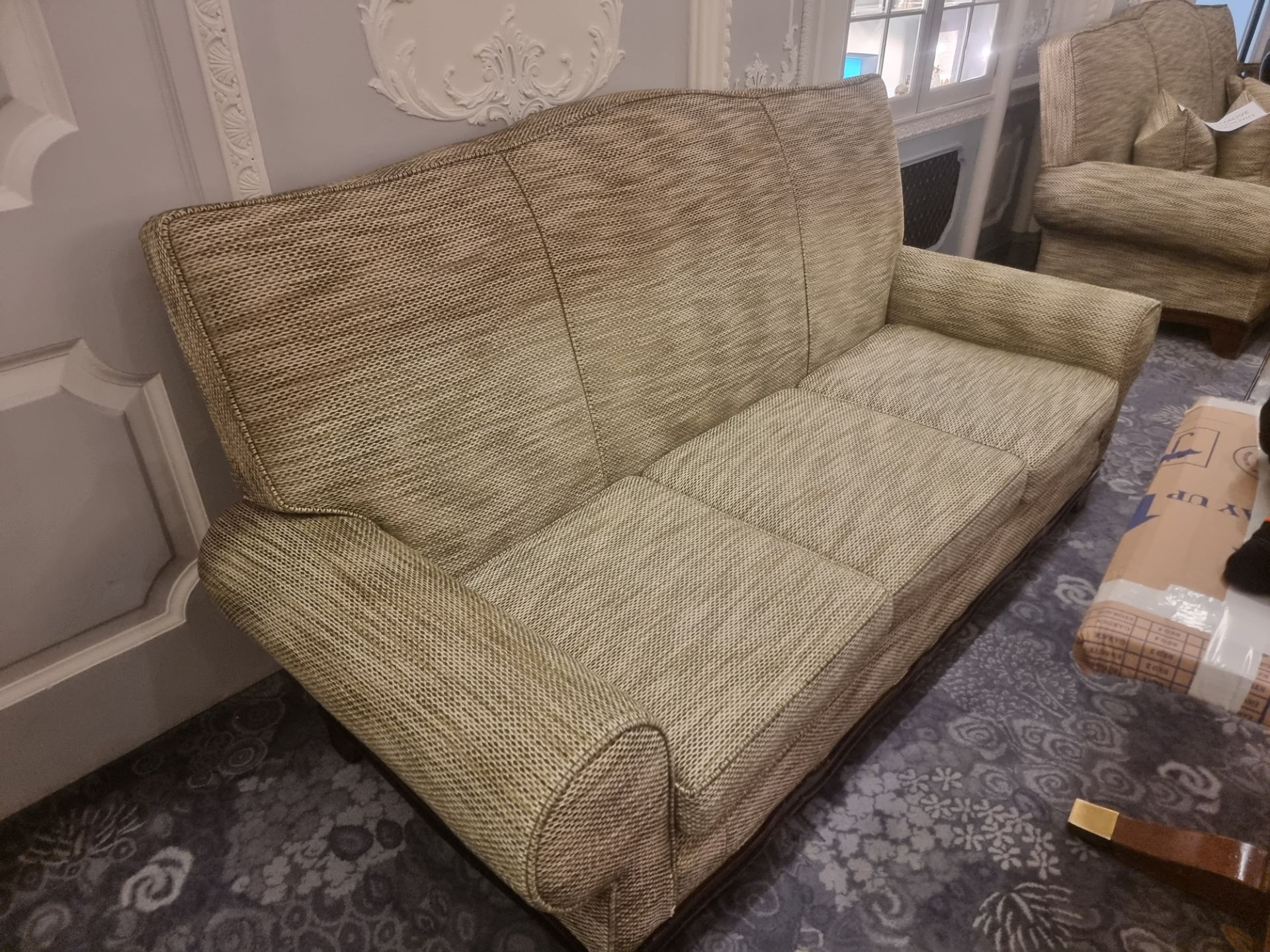 Upholstered Three Seater Sofa Classically Styled With A Shaped Back Rest And Rolled Arms On A