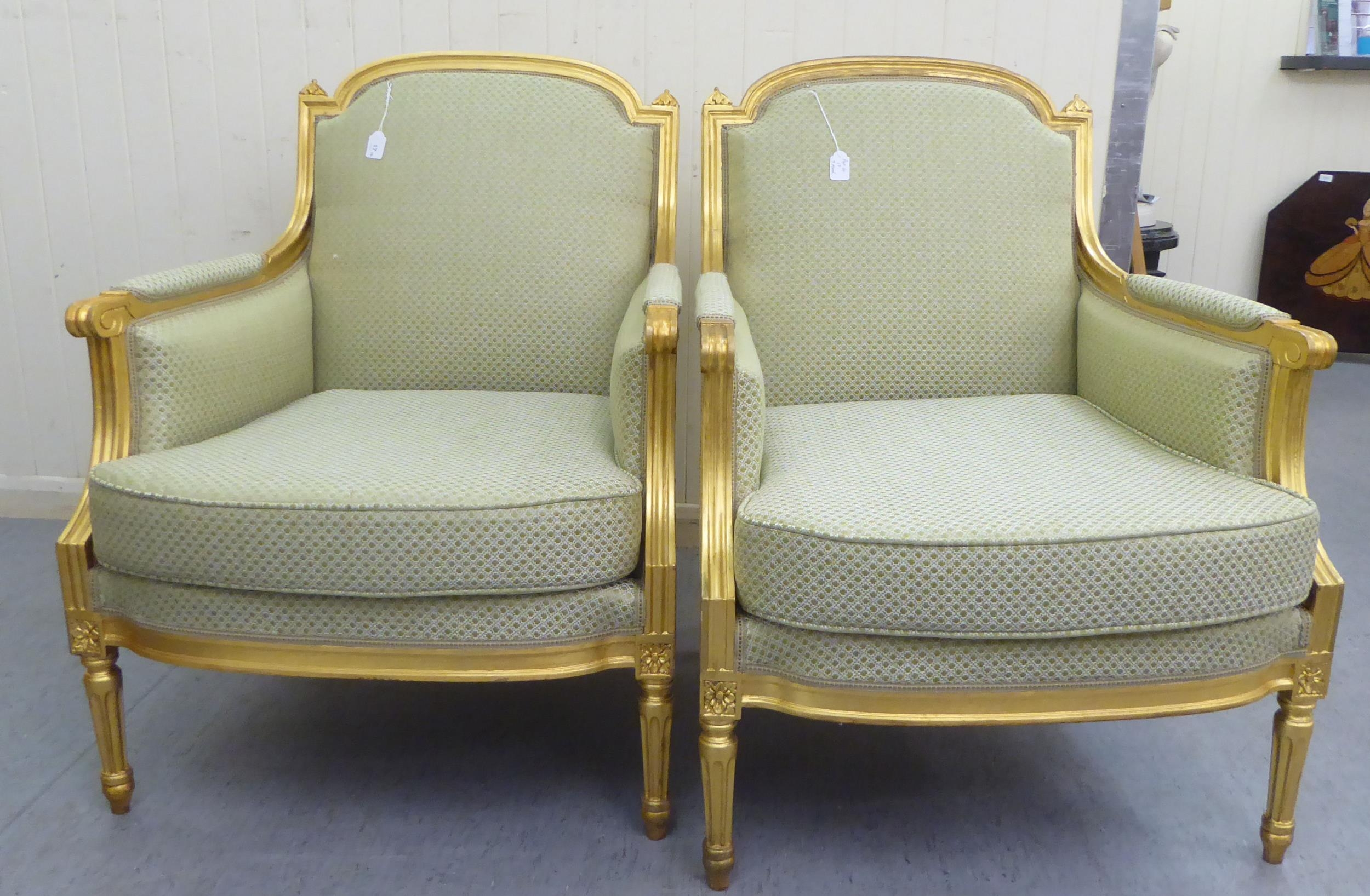 A Pair Of Louis XVI Style Antique Finished Gilded Show Wood Framed Enclosed Salon Chairs,