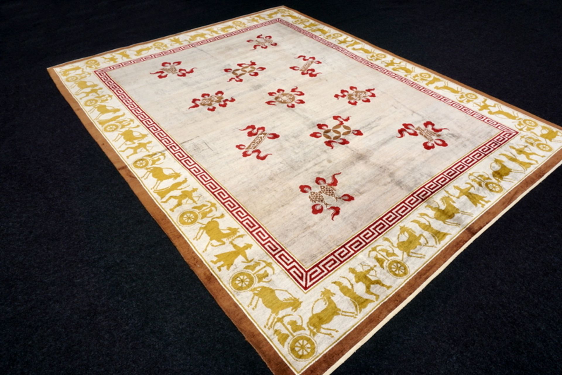 A Chinese Silk Carpet, Tientsin, Silk on Silk Foundation. The ivory field with a central column of