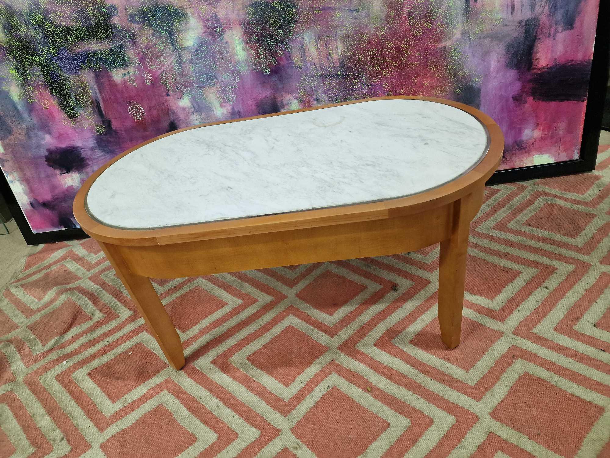 Coffee table oak oval table with a white marble top inset enhanced by silver metal trim 100 x 55 x