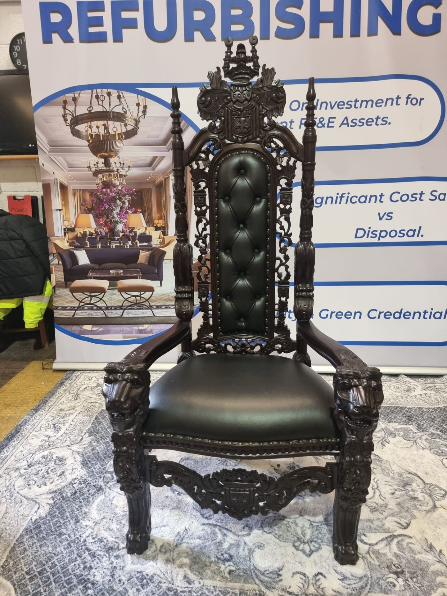 Handmade mahogany chair upholstered in a pinned black exceptional detailed carving. This antique