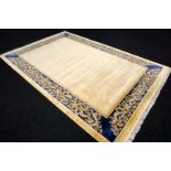 A Chinese Silk Carpet, Tientsin, Silk on Silk Foundation The plain ivory field with a blue border