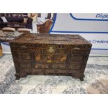 Early 20th Century Oriental Carved Camphor Wood Chest With Various Scenes Carved In Deep Relief.