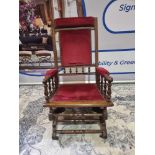 A 19th Century American Rocking Armchair The Antique Rocking Chair Upholstered In In Wine Draylon