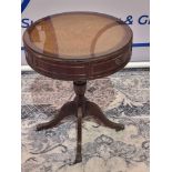 A Regency Style Mahogany Drum Table With Leather Inlay Top And Glass Protector Over The Apron