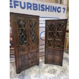 2 x Oak Corner Display Cupboards by Jaycee nicely carved throughout in the Jacobean manner with