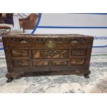 Early 20th Century Oriental Carved Camphor Wood Chest With Various Scenes Carved In Deep Relief.