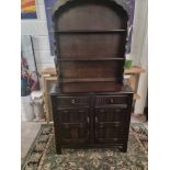 A Dutch Priory Oak Domed Top Dresser Domed And Shaped Cornice With Two Fitted Shelves The Nicely