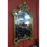 A Italian Rococo Revival Style Gilded Wood Carved Foliate Crest Wall Mirror