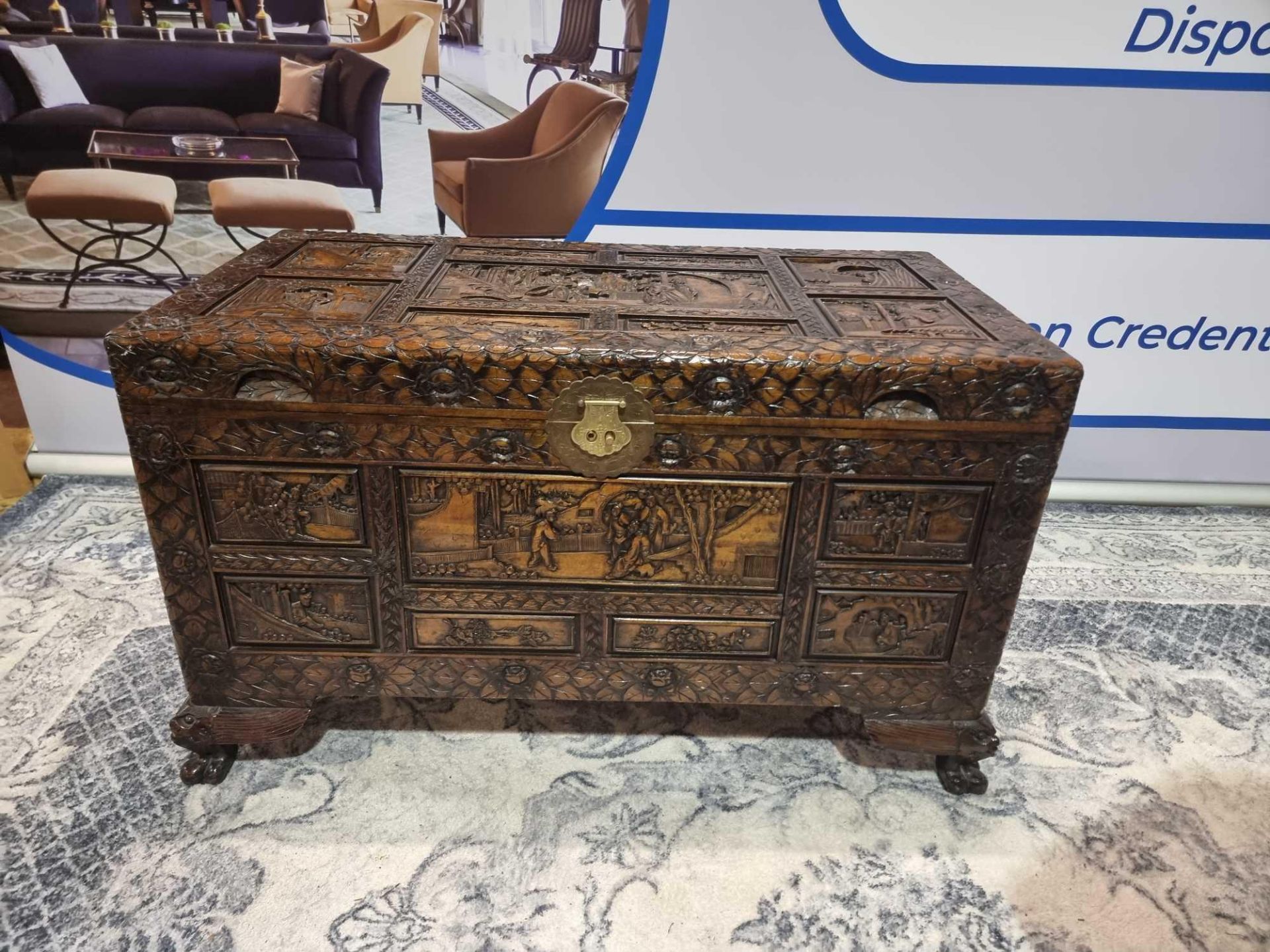 Early 20th Century Oriental Carved Camphor Wood Chest With Various Scenes Carved In Deep Relief.