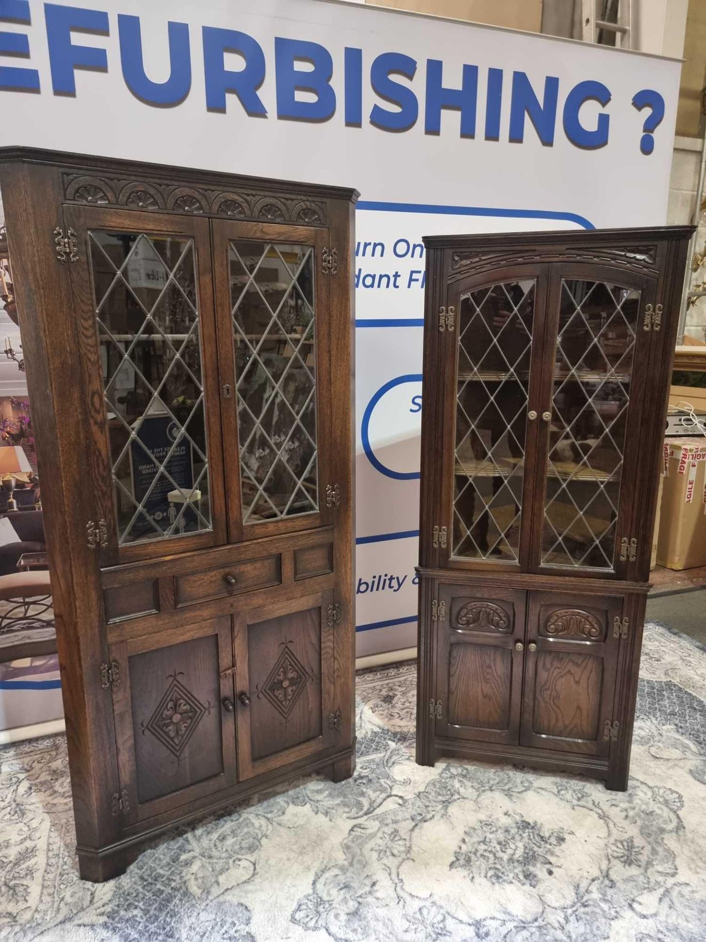 2 x Oak Corner Display Cupboards by Jaycee nicely carved throughout in the Jacobean manner with