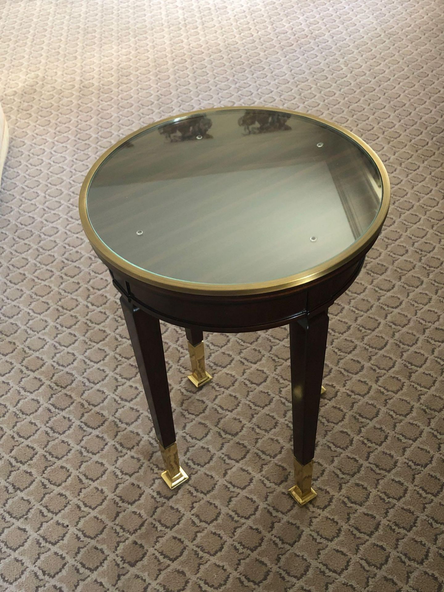 Circular Side Table With Antiqued Plate Top And Brass Trim Mounted On Tapering Legs With Brass